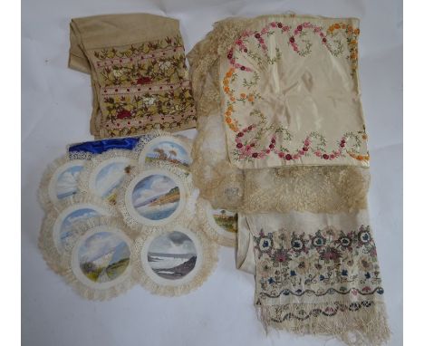 A set of twelve early 1900s lace-edged mats painted with watercolour scenes of Poole, IOW, etc., an ivory silk panel decorate