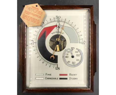 An early 20thC oak cased barometer, 28 x 23cm. 