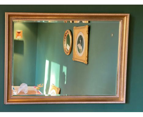 A 20thC gilt framed bevel edged mirror 70 h x 101cm w. 