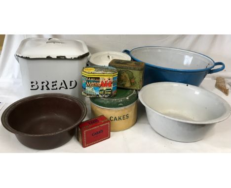A collection of enamel ware to include 2 Bread bins, 3 bowls and 4 tins. Blue bowl 55cm w, Bread bin 32cm h. 