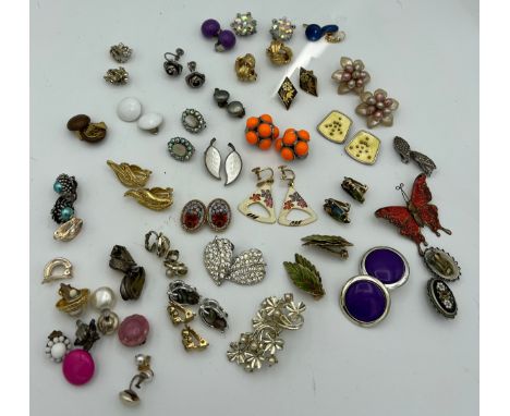 A quantity of vintage clip on earrings including two silver and enamel pairs from Norway and Denmark. 