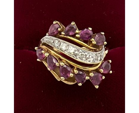 A 14 carat yellow gold ring set with pink and white gem stones. Size K. Weight 5.7gm. 