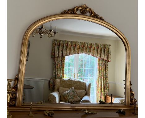 A gilt overmantel mirror. 129 w x 92cm w. 