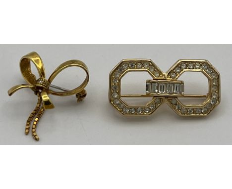 A nine carat gold brooch in the form of a bow set with single diamond and a vintage Christian Dior costume brooch. Weight of 