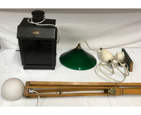 Three pieces of lighting a converted darkroom lamp with oil burner with retailer's plate for 'Reynolds &amp; Branson Ltd, a c