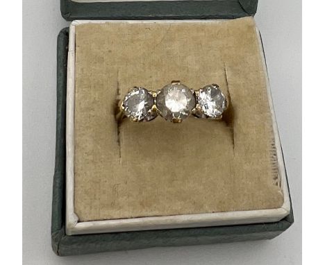 A 9 carat gold ring set with clear stones. Probably white zircon. Size K. Weight 2.2gm. 