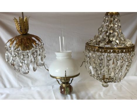 Three light fittings to include two lustres the other with an onyx base with a glass chimney and white shade. Smallest lustre