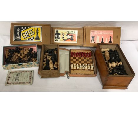 A collection of seven ebony and wooden chess piece sets in wooden boxes together with a Lindop travel chess set all in a picn