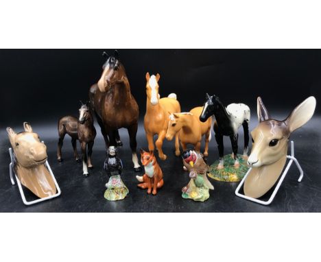 A collection of ceramic animals to include a Royal Doulton black horse, W.R. Midwinter deer faun wall plaque, horse wall plaq