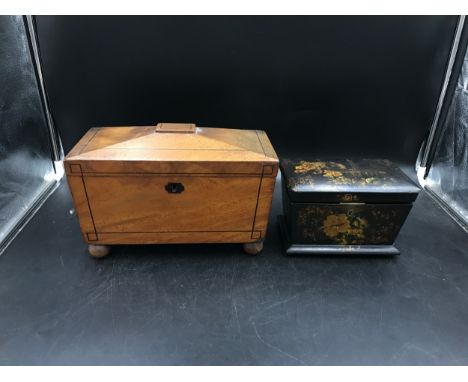 Two wooden boxes, one laquered/hand painted with fitted lined interior, the other a mahogany sarcophagus tea caddy on bun fee
