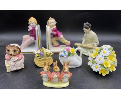 English and Continental porcelain to include a pair of book ends, Royal Albert 'Mrs Tiggy Winkle Takes Tea', Beswick 'Floppy,