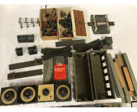 A large collection of Trix Twin Railway track 00 Gauge to include accessories, booklet, controllers, Hornby crossing etc. 