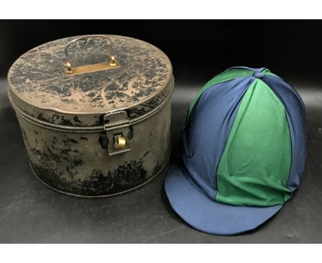 A Charles and Owen young riders jockey hat along with a Metal military hat box 