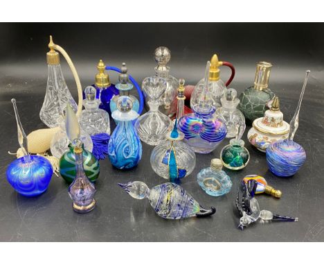 A large collection of various glass perfume bottles to include one labelled Gozo, Waterford Marquisby, one with screw lid Nov