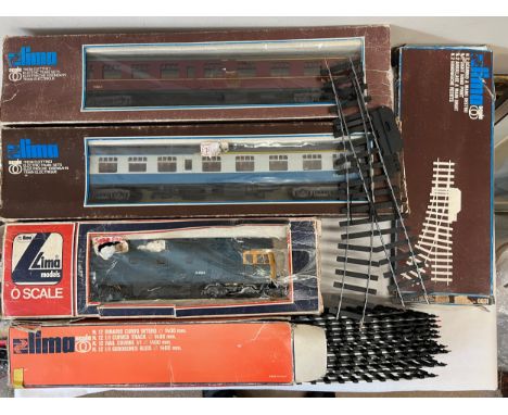 A collection of boxed Lima O Gauge trains and track to include LMS 15865 coach, 15867 coach, diesel locomotive engine class 3