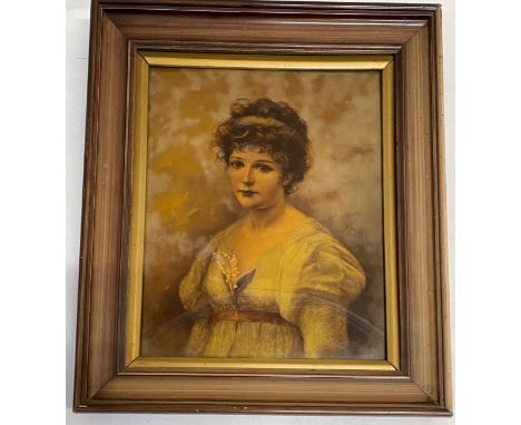 An early 20thC crystoleum print of a young lady with a sprig of Lily of the Valley in her dress printed lower right Paul Heyd