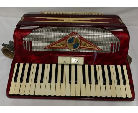 A Pigliacampo piano accordion with Bandon and Clarinet tone selection, cased made in Italy. 