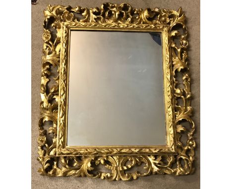 A 19thC ornate gilt wood framed mirror with replacement back. Frame 107 x 90cm. 