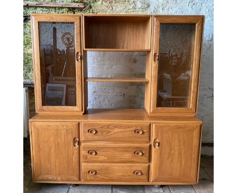 Ercol sideboard with a pair of Windsor light glazed cupboards to the top with shelves joining the two together. 172 x 44 x 15