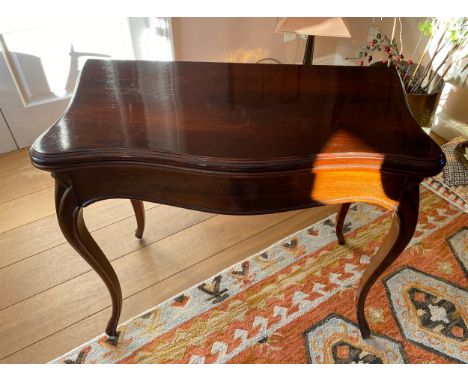 A 19thC rosewood card table on cabriole legs and baize lining. 