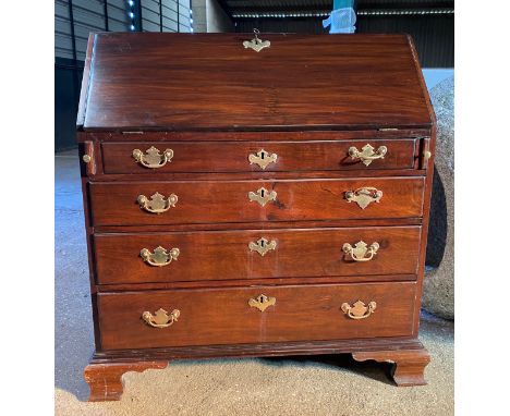 A 19thC mahogany writing bureau with 4 graduating drawers on ogee bracket feet with fitted interior and tooled leather writin