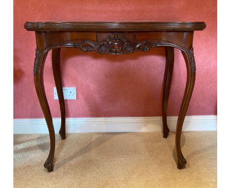 A continental mahogany carved card table with pull out drawer to support top. 82 w x 41.5 d x 77.5cm h closed. 