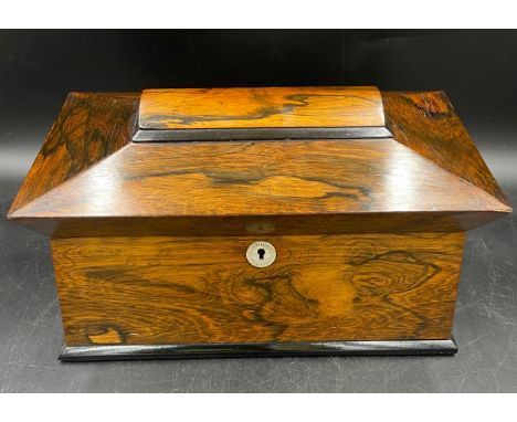 A 19thC rosewood tea caddy with two lined compartments and a central glass mixing bowl, mother of pearl escutcheon and handle