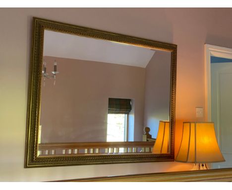 A large decretive bevel edged gilt framed mirror 105 h x 134cm w. 