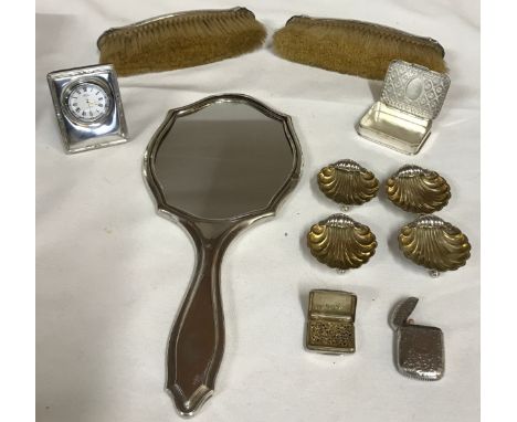 A silver backed hand mirror by Synyer &amp; Beddoes dated 1921, 2 clothes brushes marked A. Barraclough &amp; Sons Goldsmith,