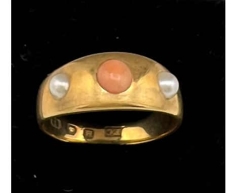 An 18 carat gold ring set with coral and seed pearls. Size K. Weight 4.1gm. 