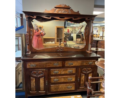 A 19thC walnut and mahogany mirror backed dresser in the Art Nouveau style. 177 h x 154 w x 49cm deep.