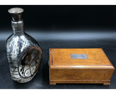 A silver overlaid Haig whiskey decanter of dimpled form with silver hallmarked stopper 23cm h together with an oak box with h