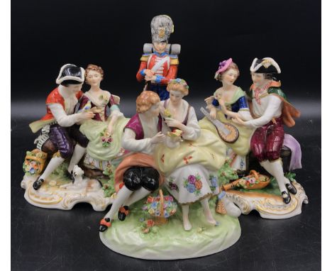 A collection of four ceramic models to include three couples with markings on the base and one royal guard marked Grenadier G