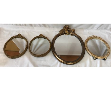 Four mirrors two matching gilt 33 x 23cm, one larger gilt 50 x 36cm with three cherubs at the top and one dressing mirror 34c