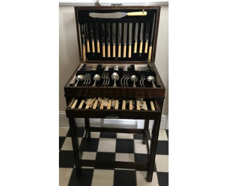 A 20thC mahogany cutlery stand 76 h x 50 w x 35cm d. containing a six piece EPNS cutlery set and various other cutlery to inc