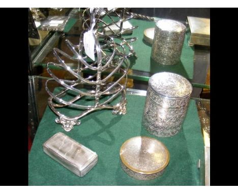A white metal snuff box , jar and cover, together with a plated toast rack