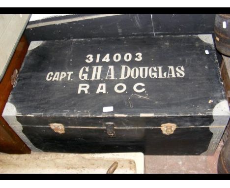 An old military trunk inscribed to the top 'Capt G H A Douglas A.O.C.'