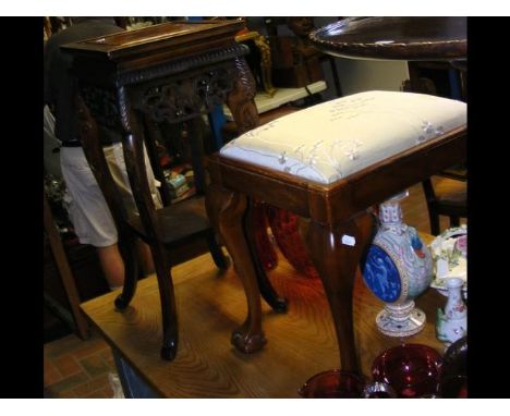 A two tier plant stand, together with a stool