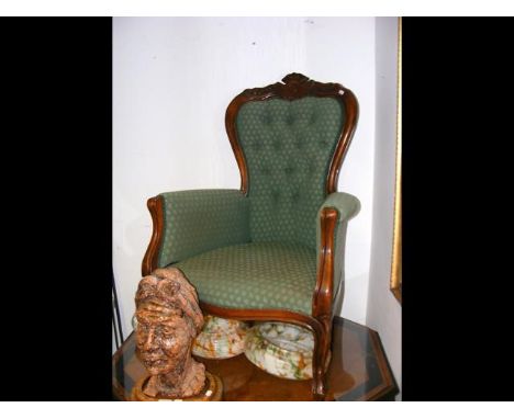 A Victorian style button back armchair
