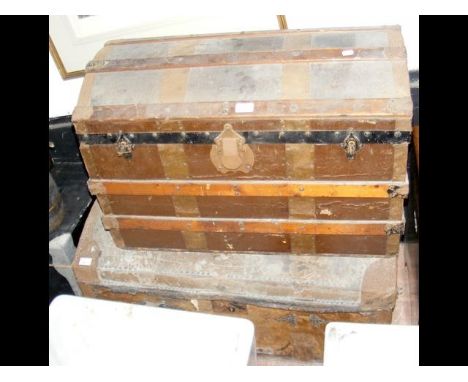 An antique domed top trunk, together with one other