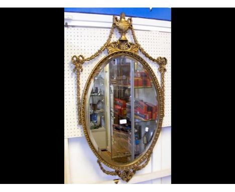 An Adams style oval wall mirror