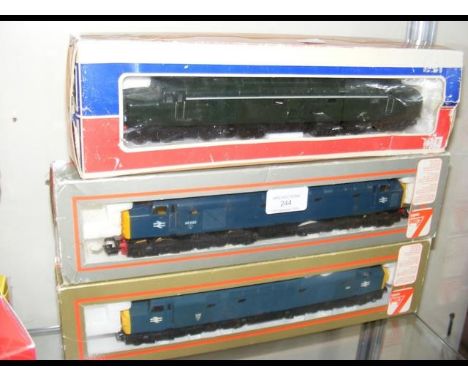 A boxed Lima locomotive, together with two others
