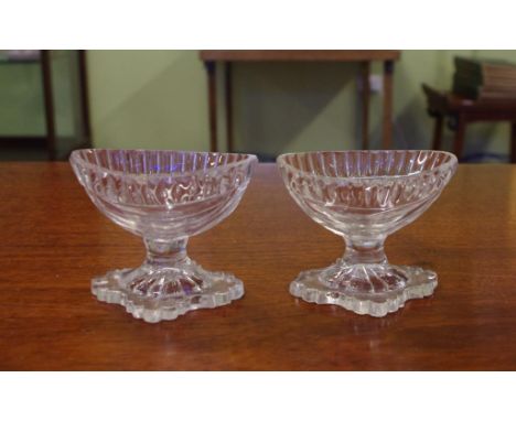 Two Georgian cut crystal salts with lemon squeezer base, 7cm high approx