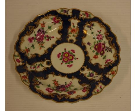 First period Worcester hand painted plate blue scale ground with floral decoration, circa 1755-75, 19.5cm diameter. Purchased