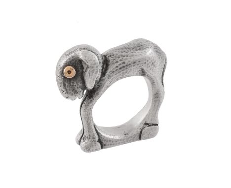 A 1940s silver lamb ring by Mosheh Oved, the stylised new-born lamb with hammered coat and bulbous gold eyes, inscribed with 