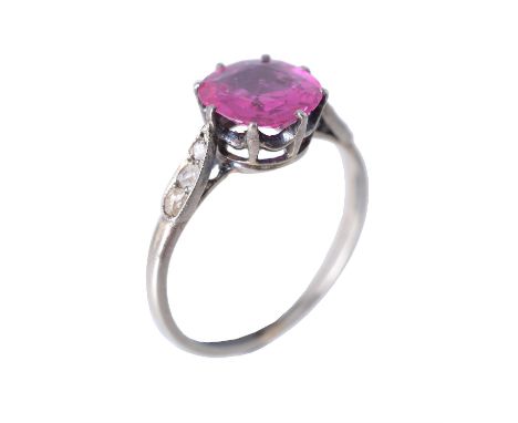 An early 20th century pink sapphire and diamond ring, circa 1910, the cushion cut pink sapphire estimated to weigh 1.30 carat