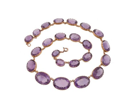 A mid Victorian amethyst rivière necklace, circa 1860, the graduated oval cut amethysts measuring 12mm to 20mm, within gold c
