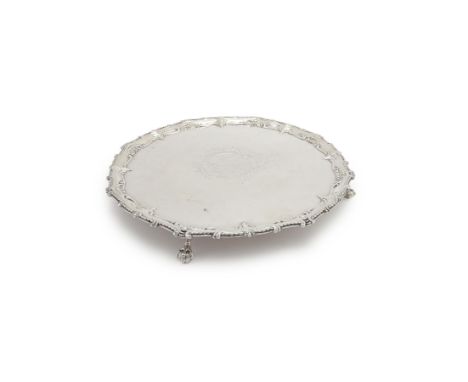 A George III silver shaped circular salver by Richard Rugg I, London 1768, the oval beaded raised rim with scrolls and leafag