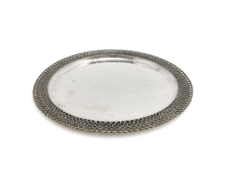 A silver parcel gilt circular salver by Stuart Devlin, London 1980, with a raised gilt openwork 'mesh' border, the centre ham
