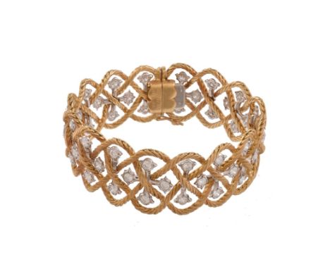 A two colour diamond bracelet by Buccellati, the open woven links interspaced with brilliant cut diamonds in shaped settings,